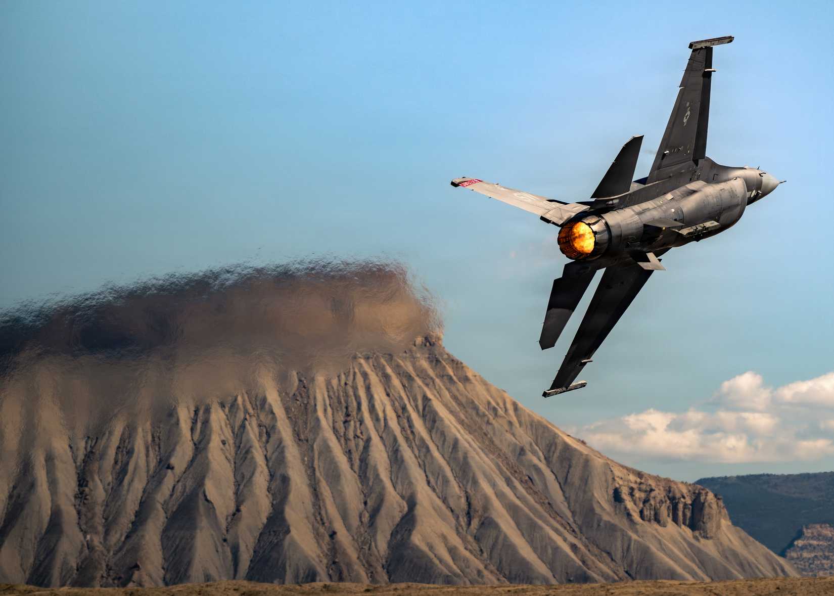 Air Force Maj. Taylor “FEMA” Hiester, F-16 Viper Demonstration Team commander and pilot, performs aerial maneuvers in a U.S. Air Force F-16C Fighting Falcon