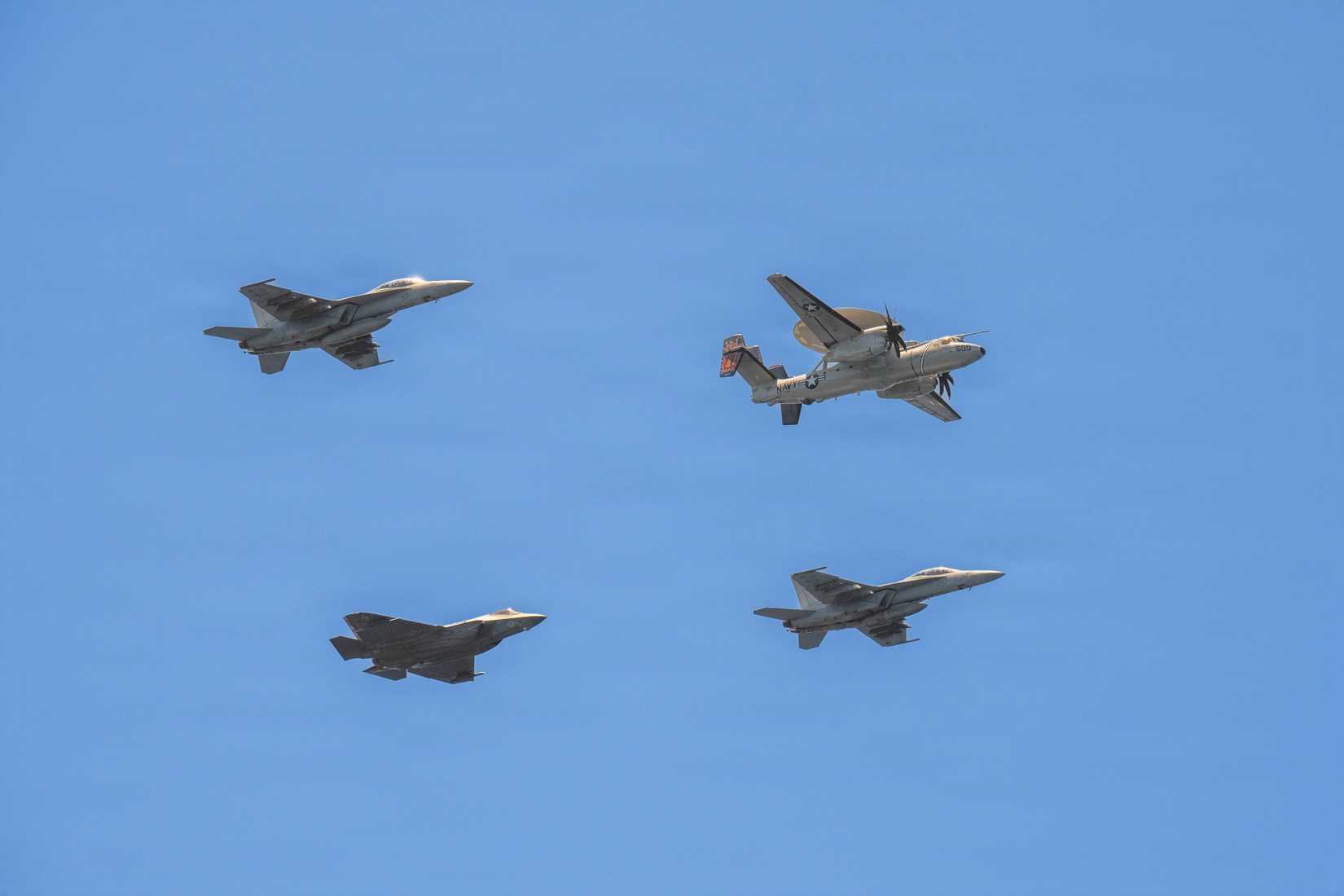 Aircraft assigned to Carrier Air Wing (CVW) 11, fly in formation during a friends and family day cruise hosted by Nimitz-class aircraft carrier USS Theodore Roosevelt (CVN 71)