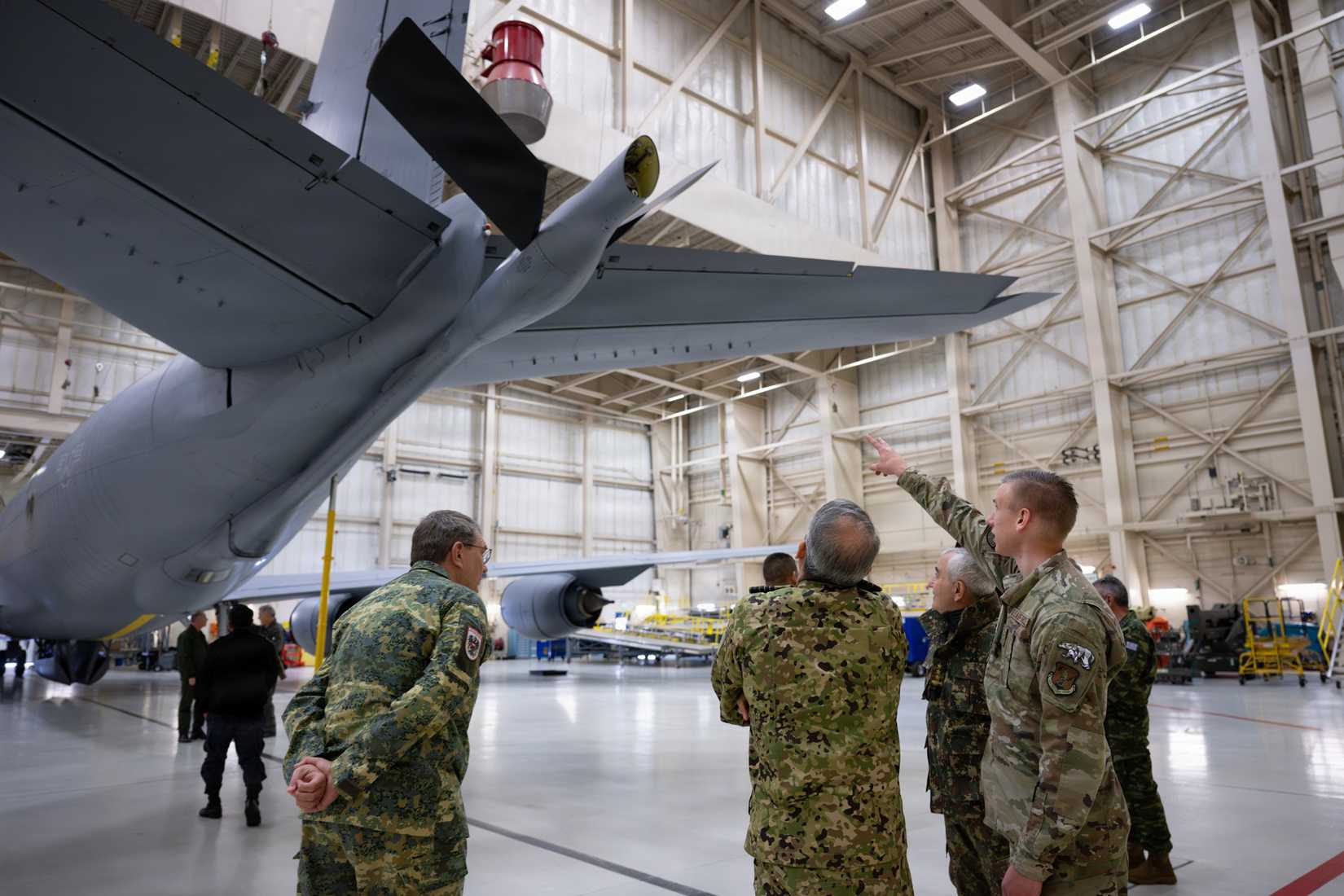 Airman First Class Jayson Sjoblon, 168th Maintenance Squadron maintainer, explains features of a KC-135 Stratotanker to international defense personnel at Eielson Air Force Base