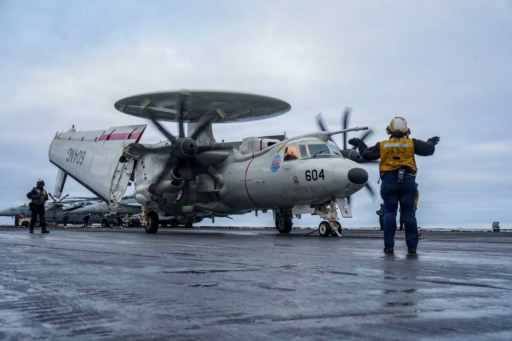 An E-2D Hawkeye, assigned to Airborne Command & Control Squadron (VAW) 117, prepares to launch from the flight deck of Nimitz-class aircraft carrier USS Abraham Lincoln (CVN 72)