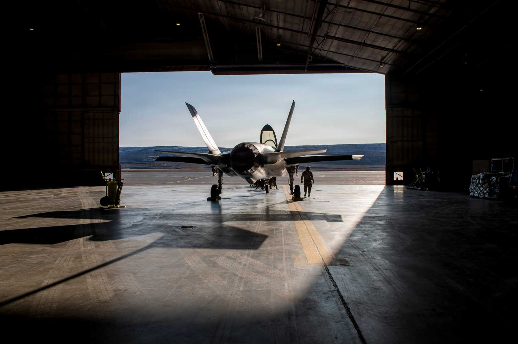 An F-35A Lightning II aircraft assigned to the 115th Fighter Wing, Wisconsin Air National Guard, gets parked in a hangar