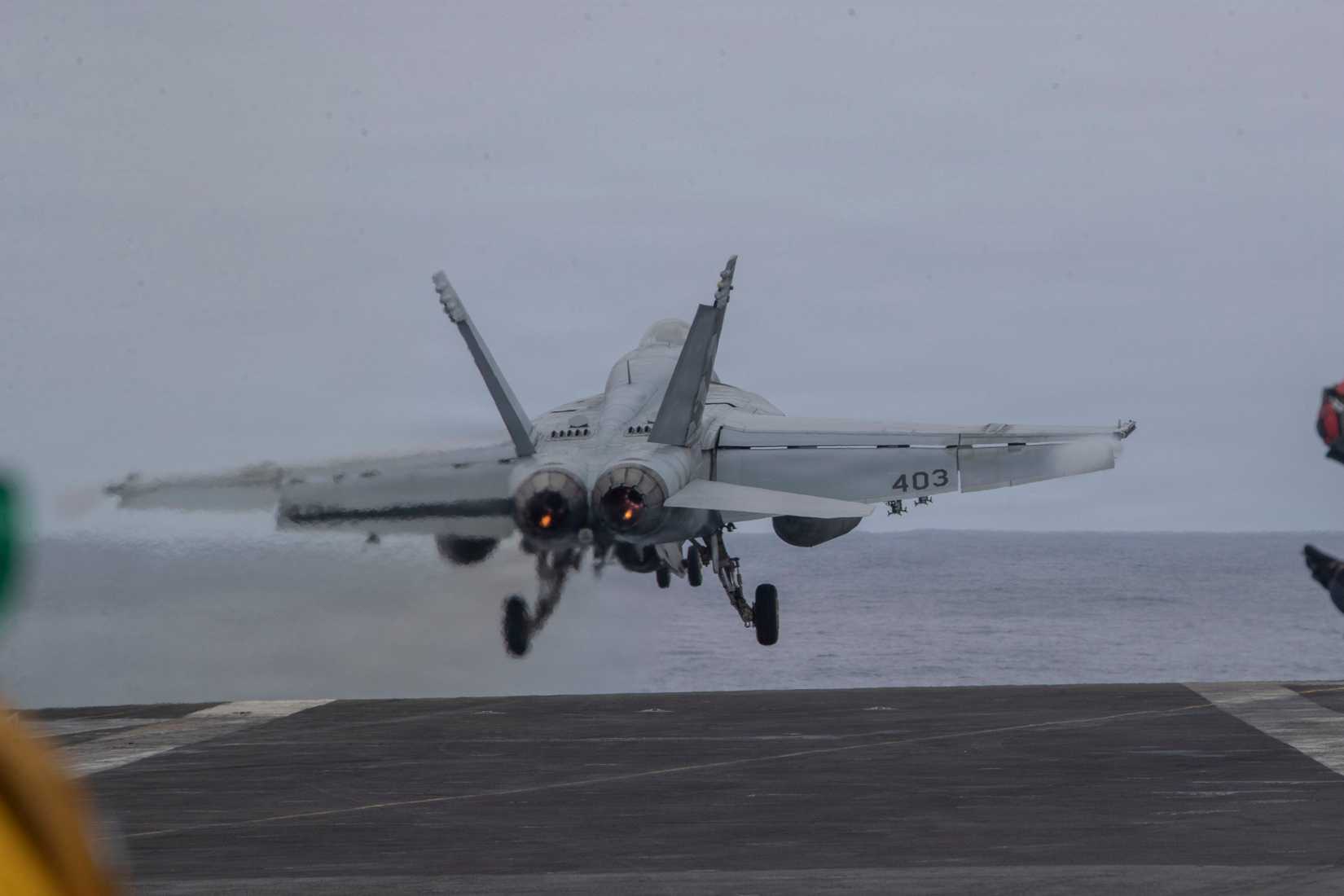 An FA-18E Super Hornet, assigned to Strike Fighter Squadron (VFA) 151, launches from the flight deck of Nimitz-class aircraft carrier USS Abraham Lincoln (CVN 72)