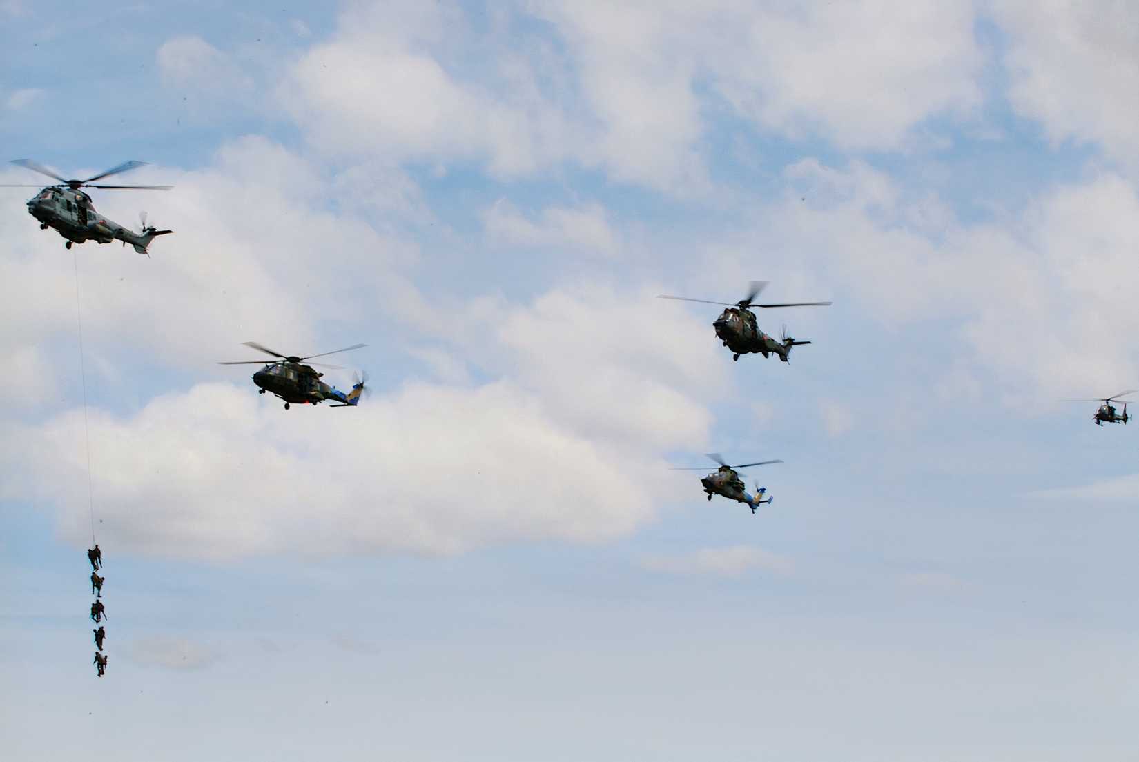 French military helicopters in formation