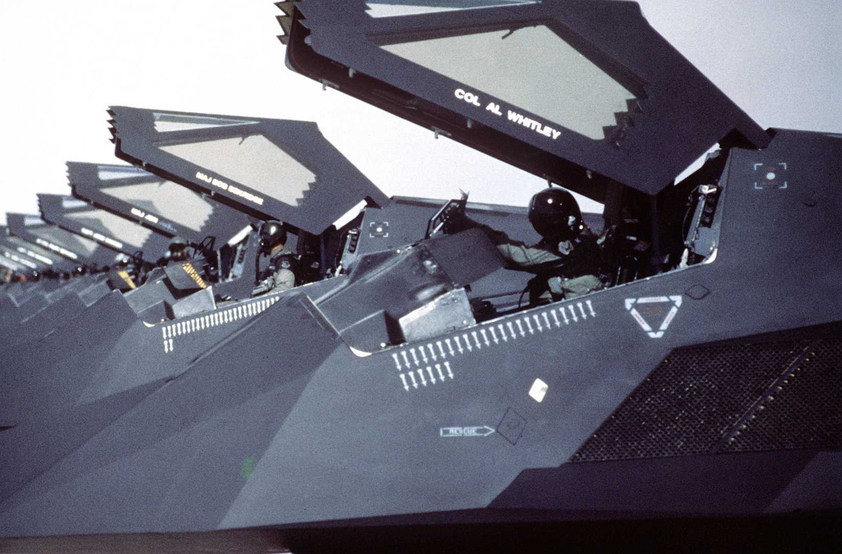 F-117 stealth fighter aircraft of the 37th Tactical Fighter Wing stand on the flight line with canopies raised following their return from Saudi Arabia where they took part in Operation Desert Storm.