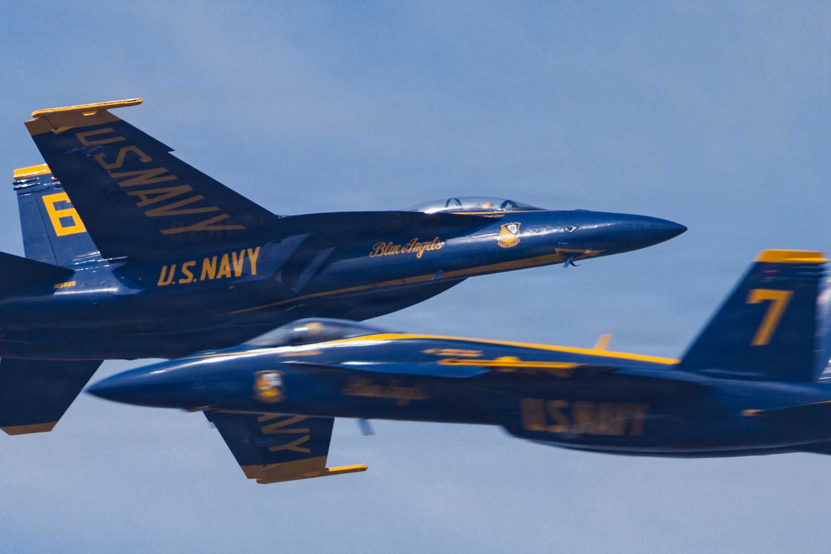 FA-18 Super Hornet aircraft with the U.S. Navy flight demonstration squadron, the Blue Angels, execute a high-speed pass