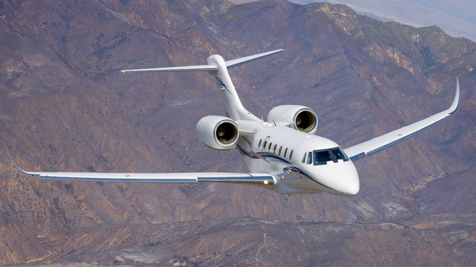 Frontal view of a Citation X (business jet) over South California