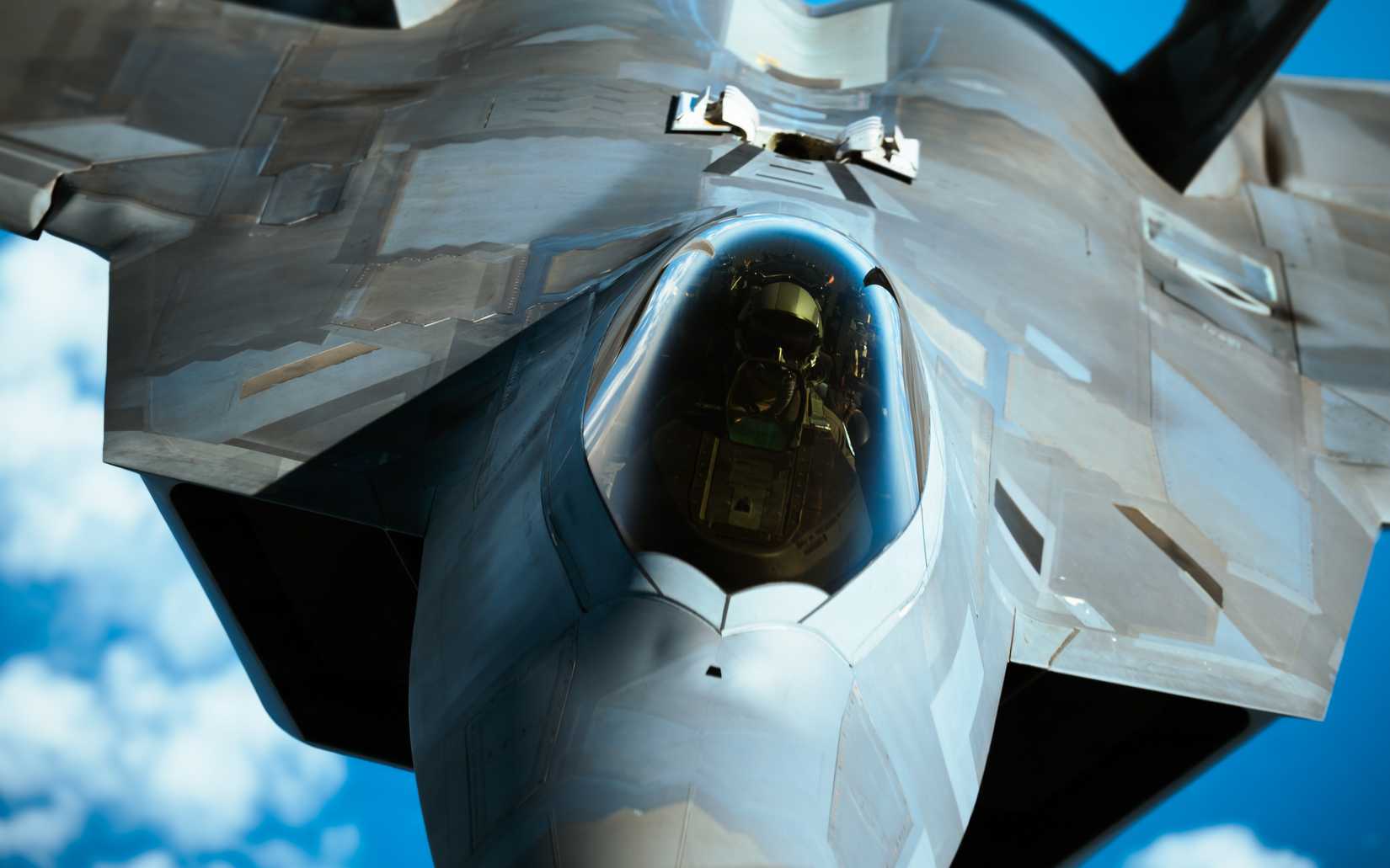 ir Force F-22 Raptor assigned to the 525th Expeditionary Fighter Squadron, deployed from Joint Base Elmendorf-Richardson, Alaska, receives fuel from a KC-135 Stratotanker