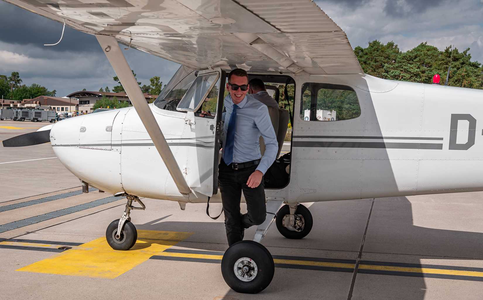 Luca Born, pilot, exits a Cessna 172 Skyhawk trainer aircraft on the flight line at Ramstein Air Base, Germany