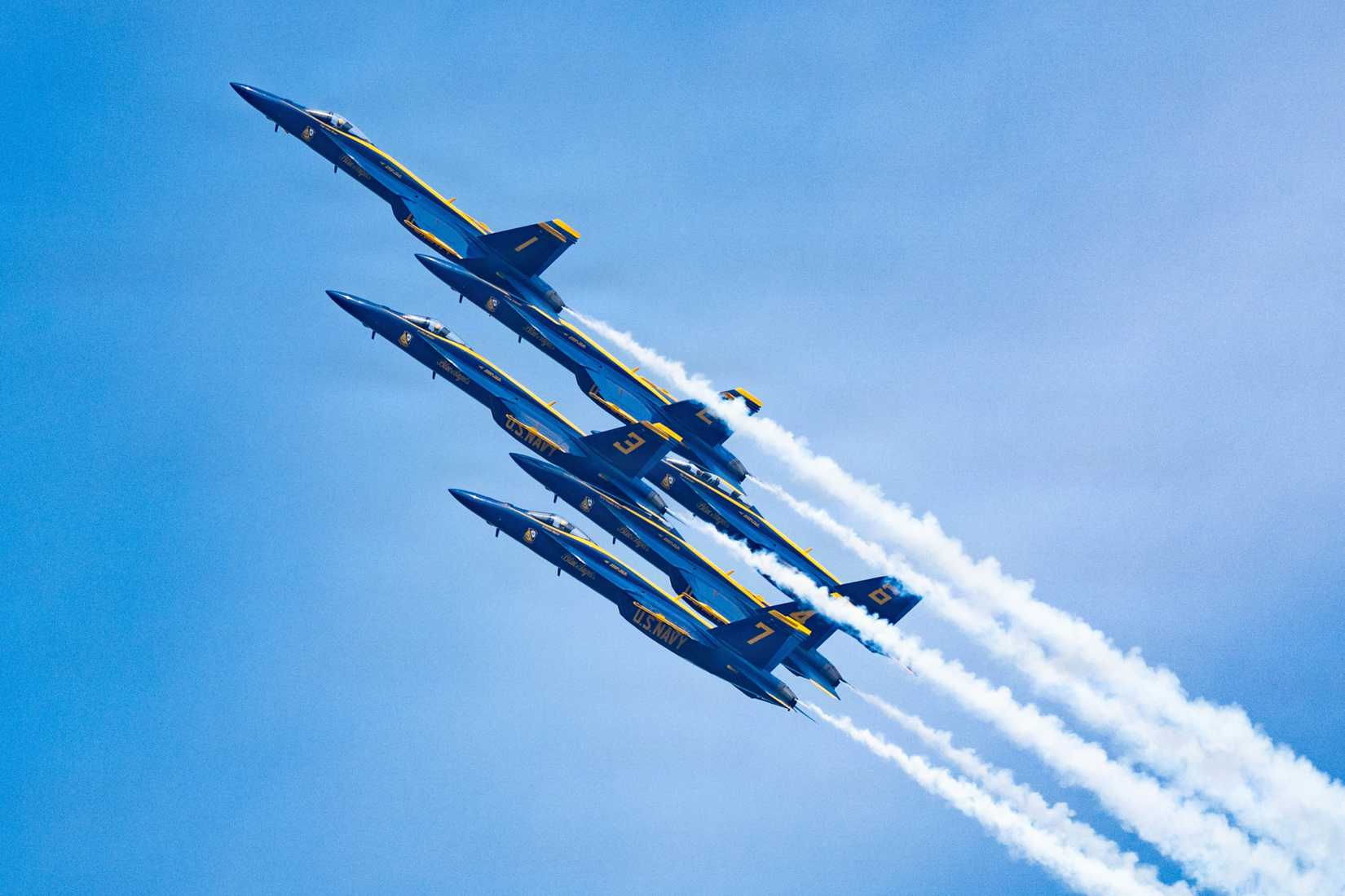 Navy FA-18 Super Hornet aircraft with the flight demonstration squadron, the Blue Angels, fly in delta formation