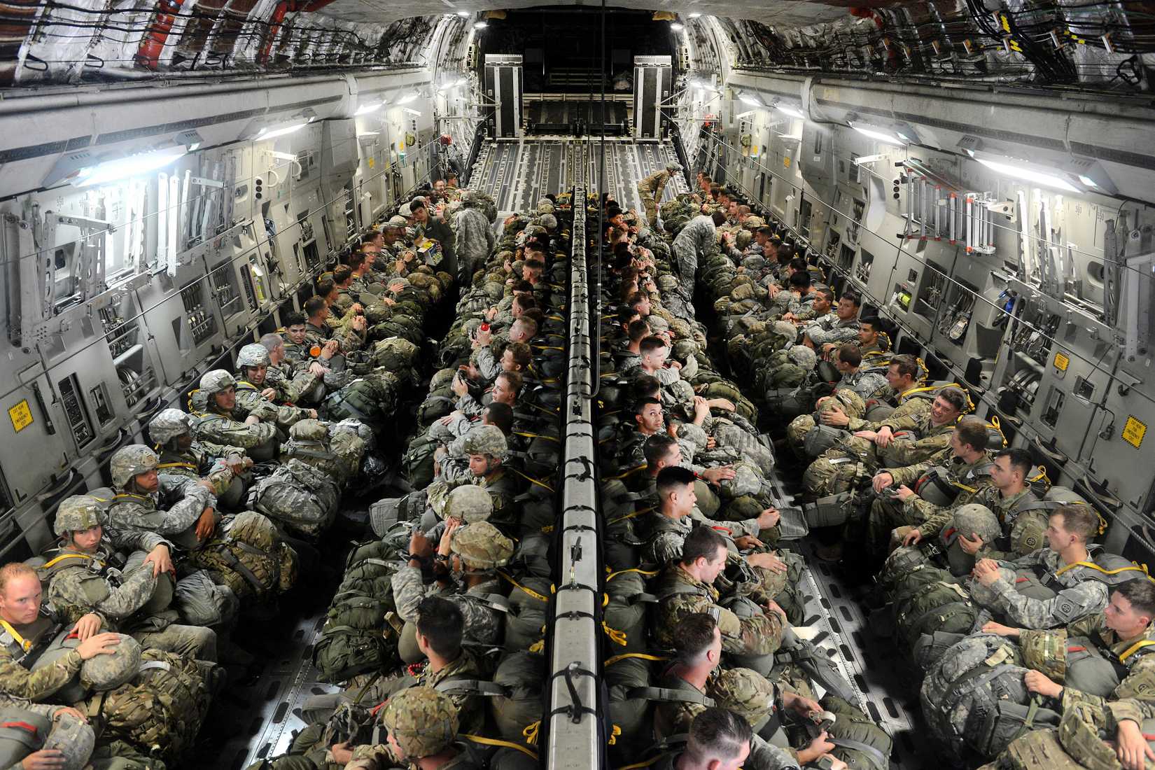 Paratroopers sit inside a C17 Globemaster III aircraft before participating in airborne operations over Sicily drop zone during Battalion Mass Tactical Week at Pope Army Airfield, N.C., July 12, 2016.