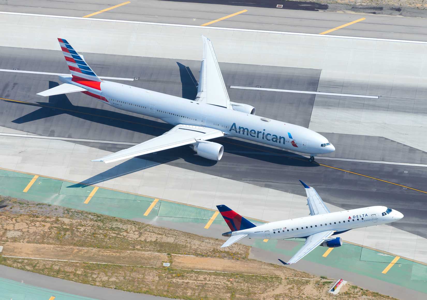 Delta E-Jet Flying Past American 777