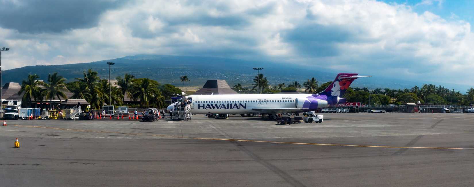 Kalaoa, Hawaii /USA - January 29 2018: Panoramic view of Hawaiian Airlines flight boarding on the Kona International Airport runway.