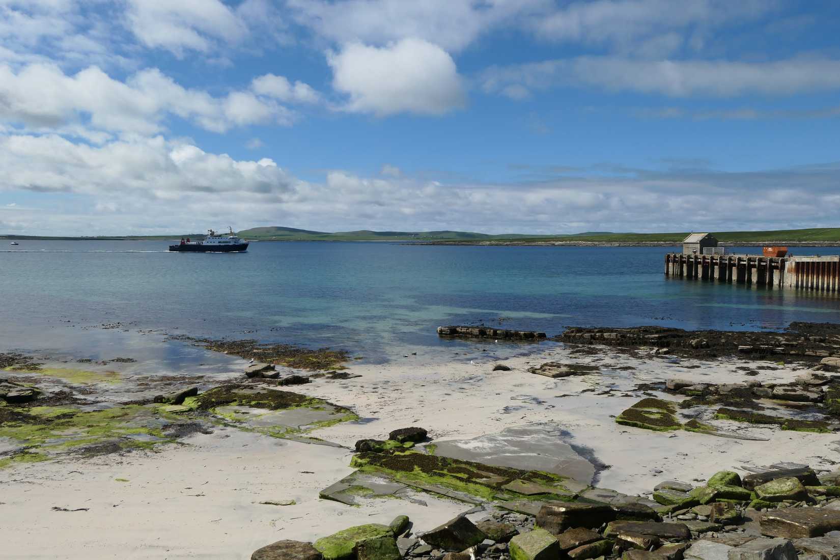 A Ferry arriving at the pier on Papa Westray, Orkney, Scotland, UK