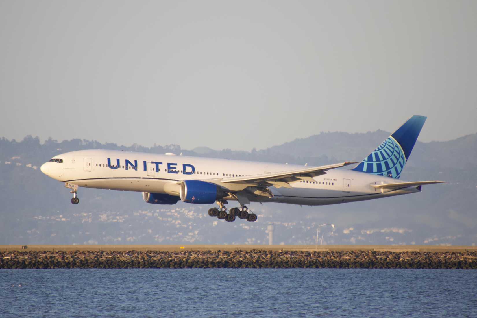 United Airlines Boeing 777 aircraft landing at San Francisco International Airport