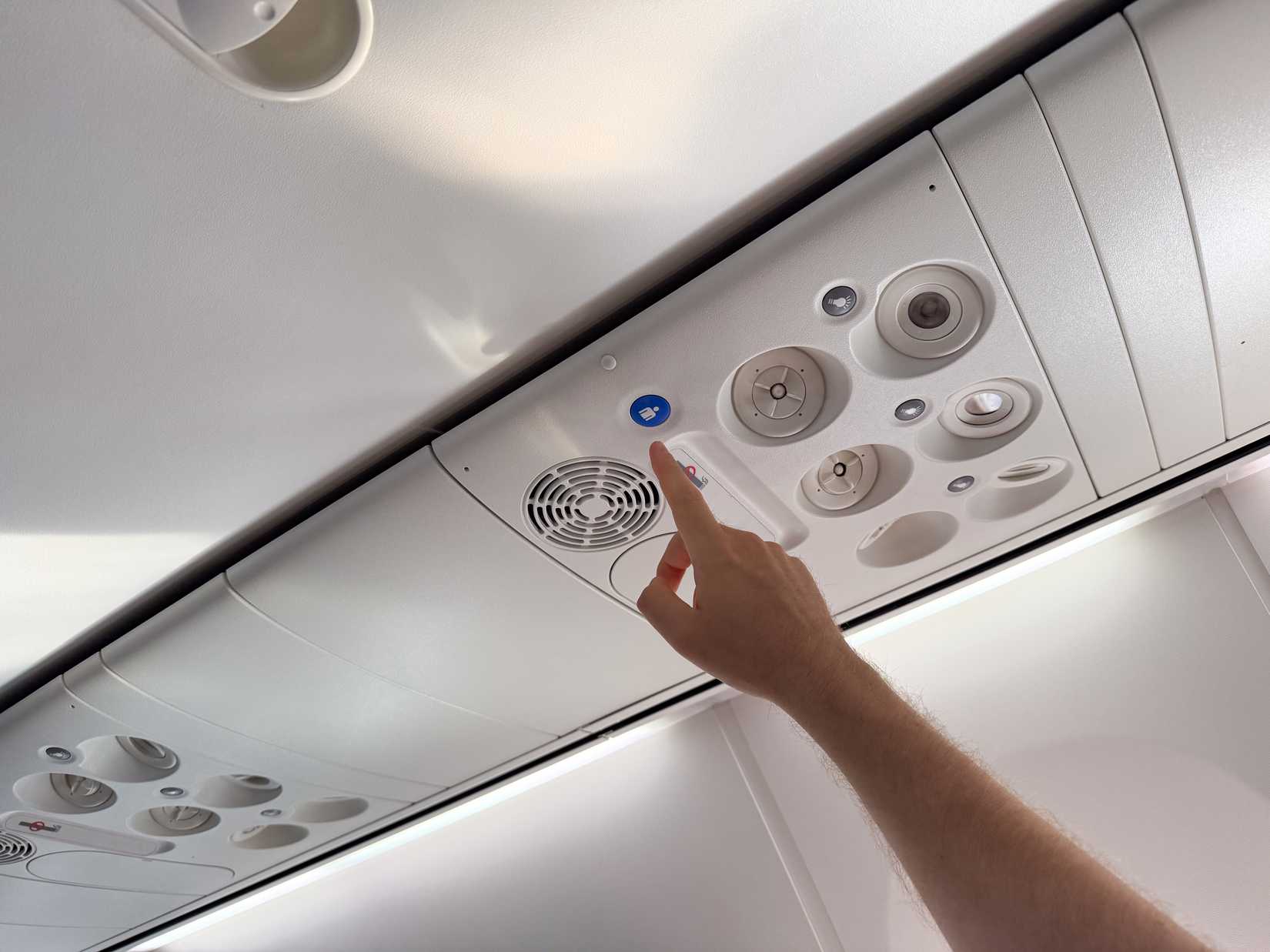 passenger reaching for call button on PSU