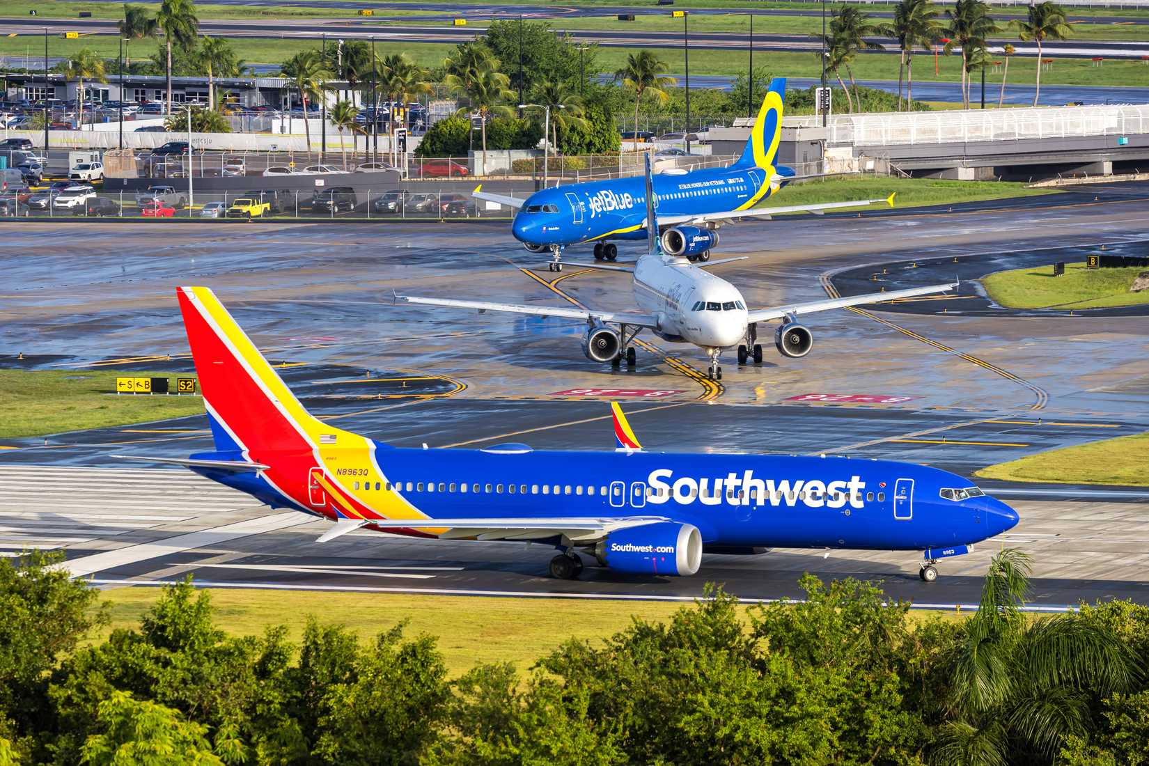 southwest airlines jet blue and one other aircraft at San Juan