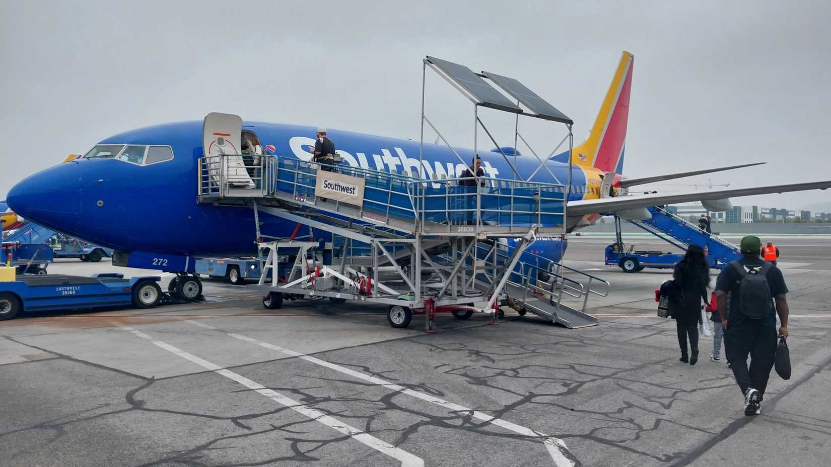 Burbank, California - December 23, 2025: Southwest Airlines passengers walk to their aircraft