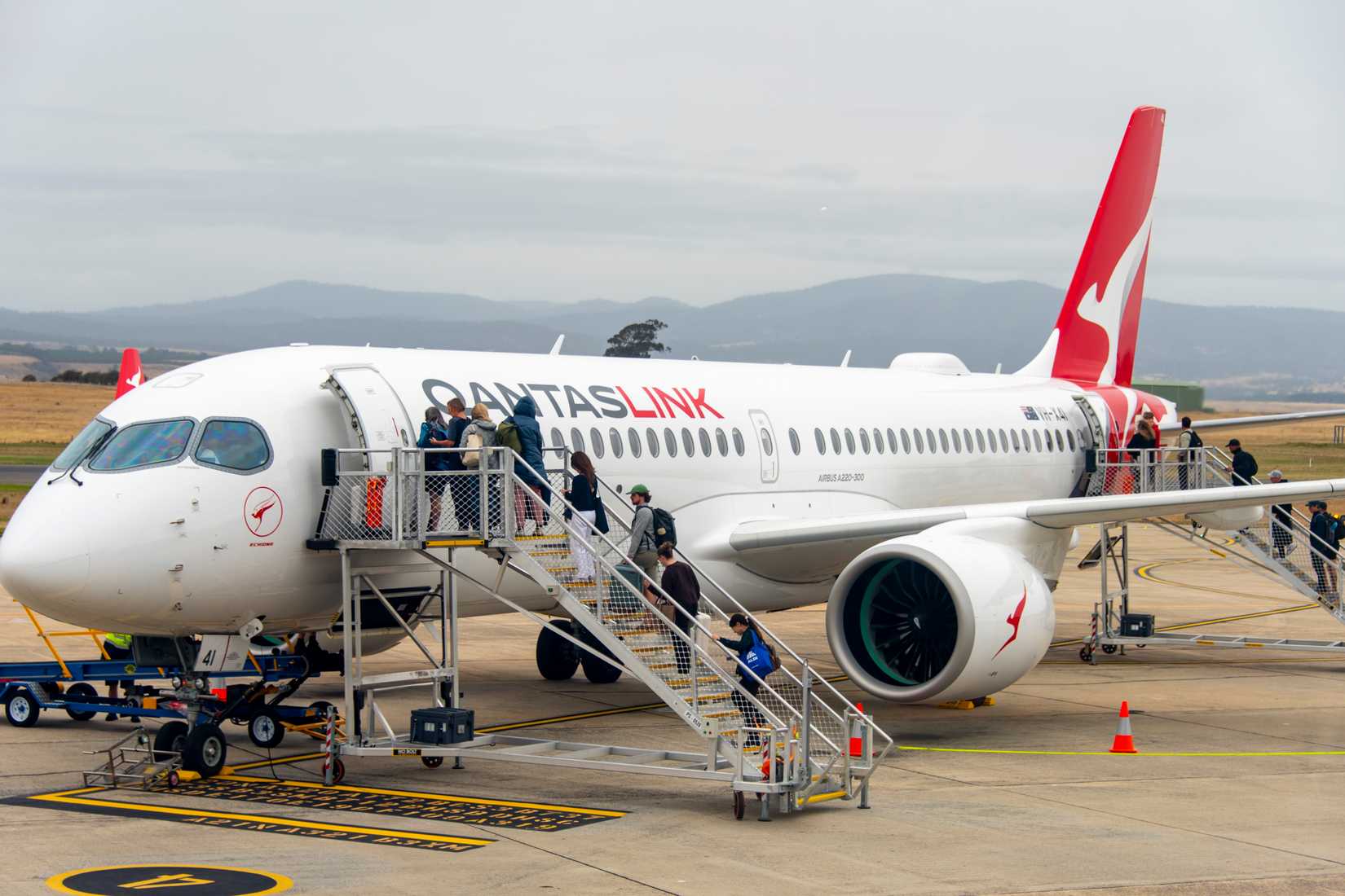 Launceston, Australia - March 16, 2026: Passengers boarding a QantasLink Airbus A220-300