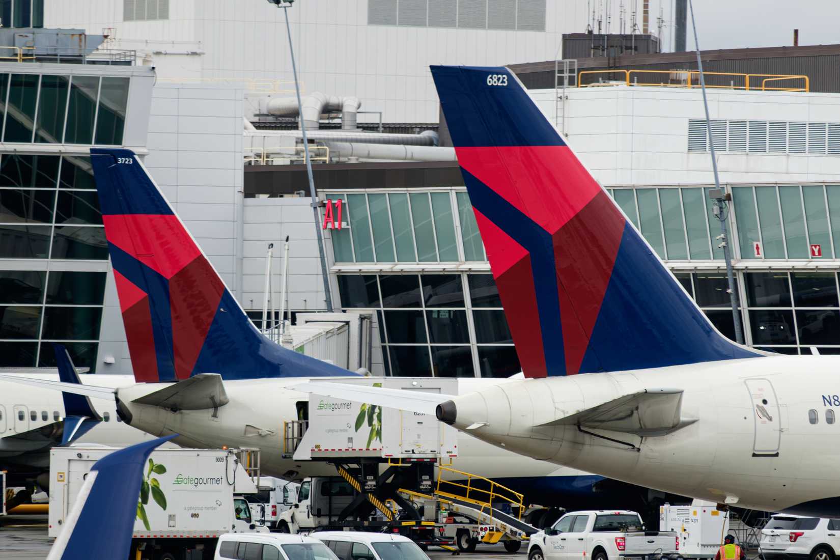 Two Delta Air Lines aircraft parked at the gate at Seattle Tacoma