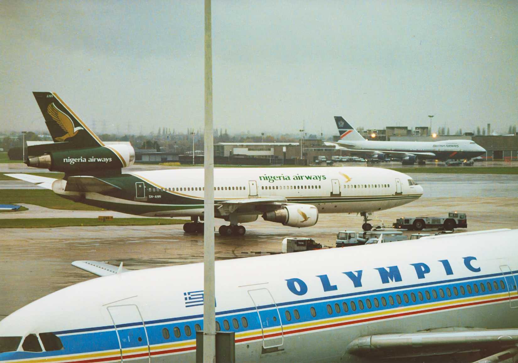 Airbus A300 Parked, McDonnell Douglas DC-10 Taxiing, And Boeing 747 Taking Off