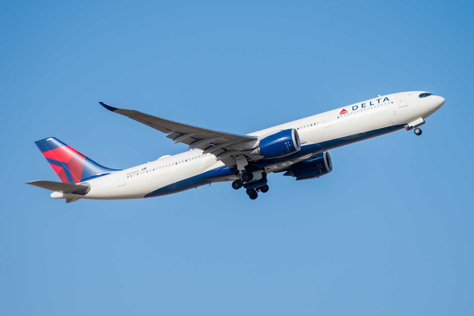 Madrid, Spain - September 8, 2026. Delta Air Lines Airbus A330neo taking off into a clear blue sky.