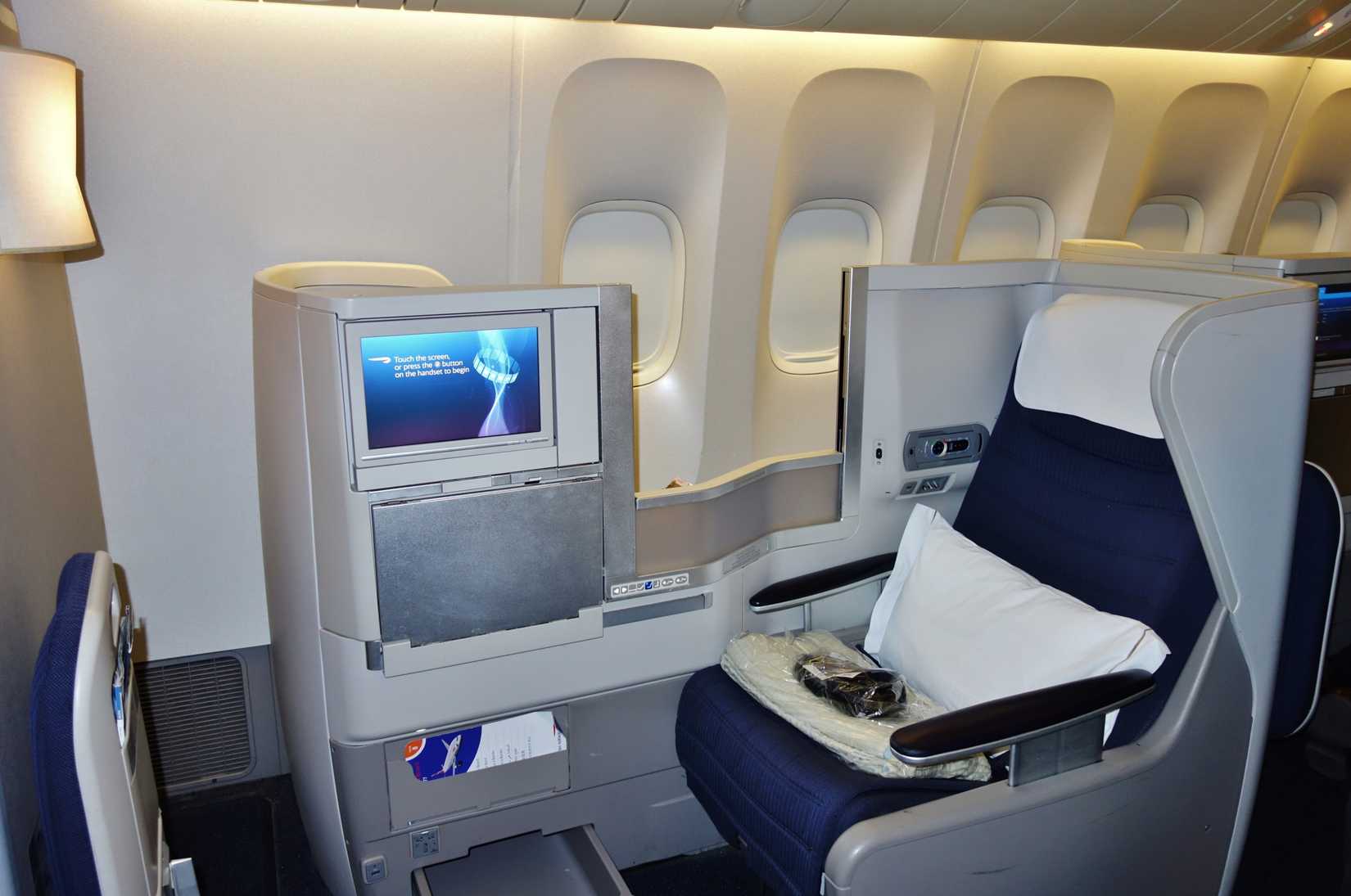 HEATHROW, ENGLAND -12 MAY 2017- Inside view of the Club World Business Club cabin and seats inside a British Airways (BA) airplane. BA is a member of the OneWorld alliance.