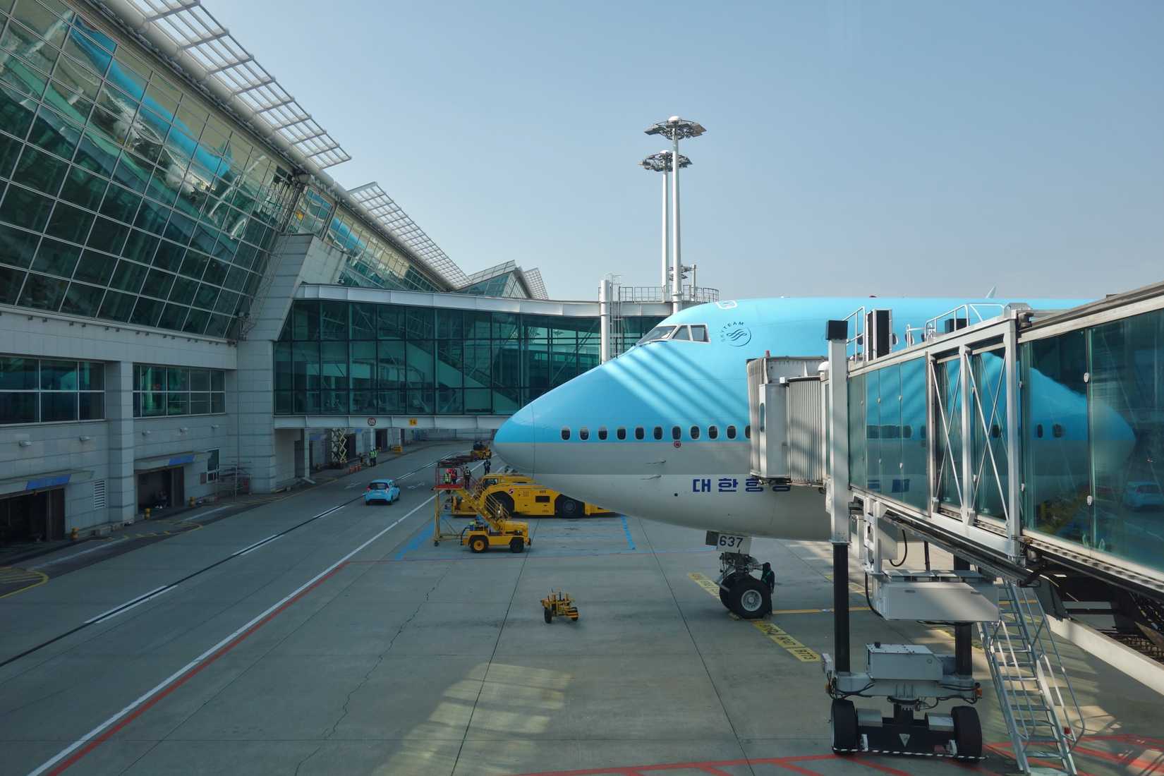 A Korean Air Boeing 747 parked at the gate