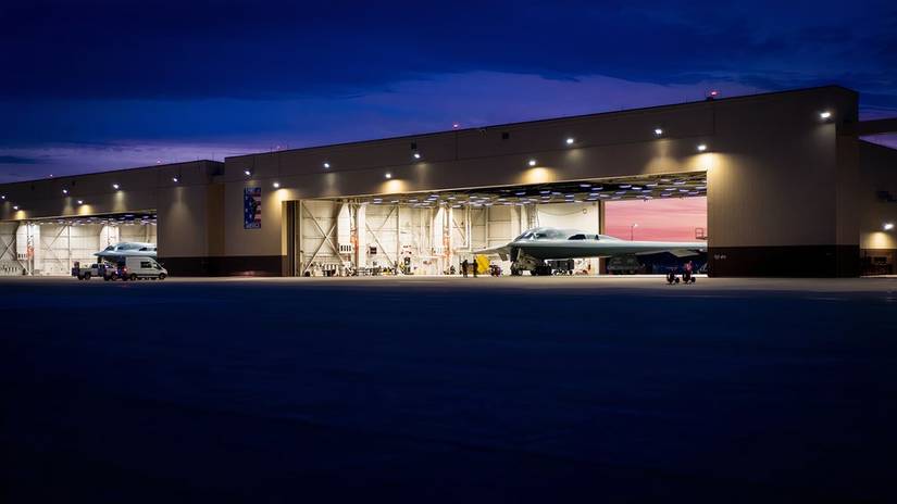 A photo of a B-2 bombers in their respective hangars.
