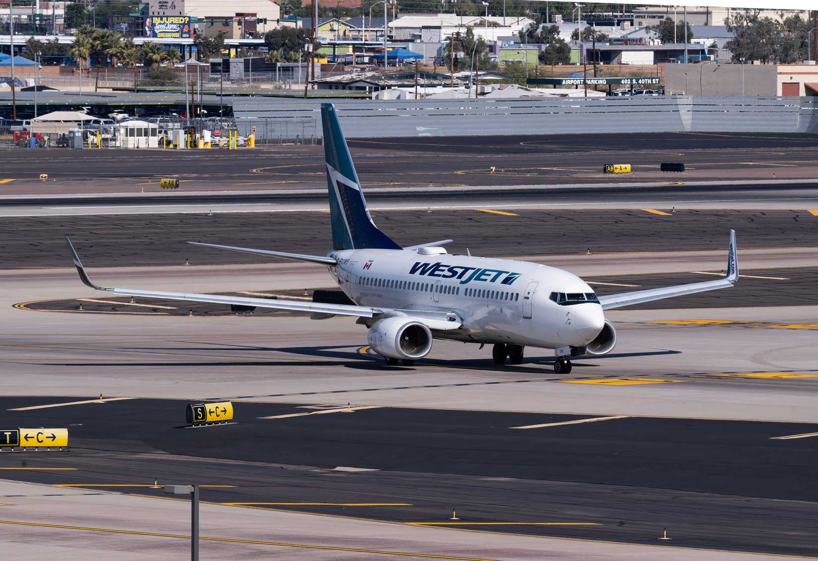 WestJet Airlines Boeing 737-700 C-FUWS turning onto taxiway S at Sky Harbor International Airport